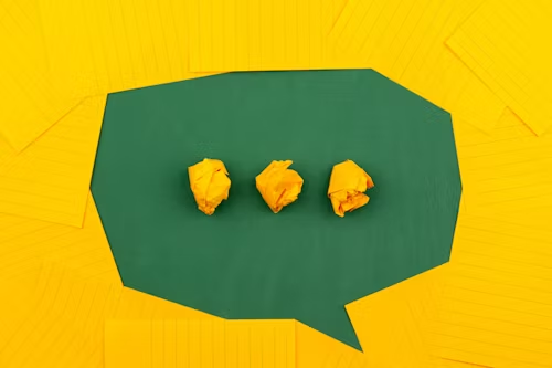Three yellow crumpled paper with green background