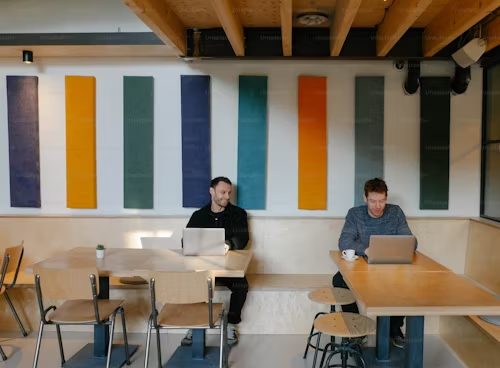 Two person on a laptop