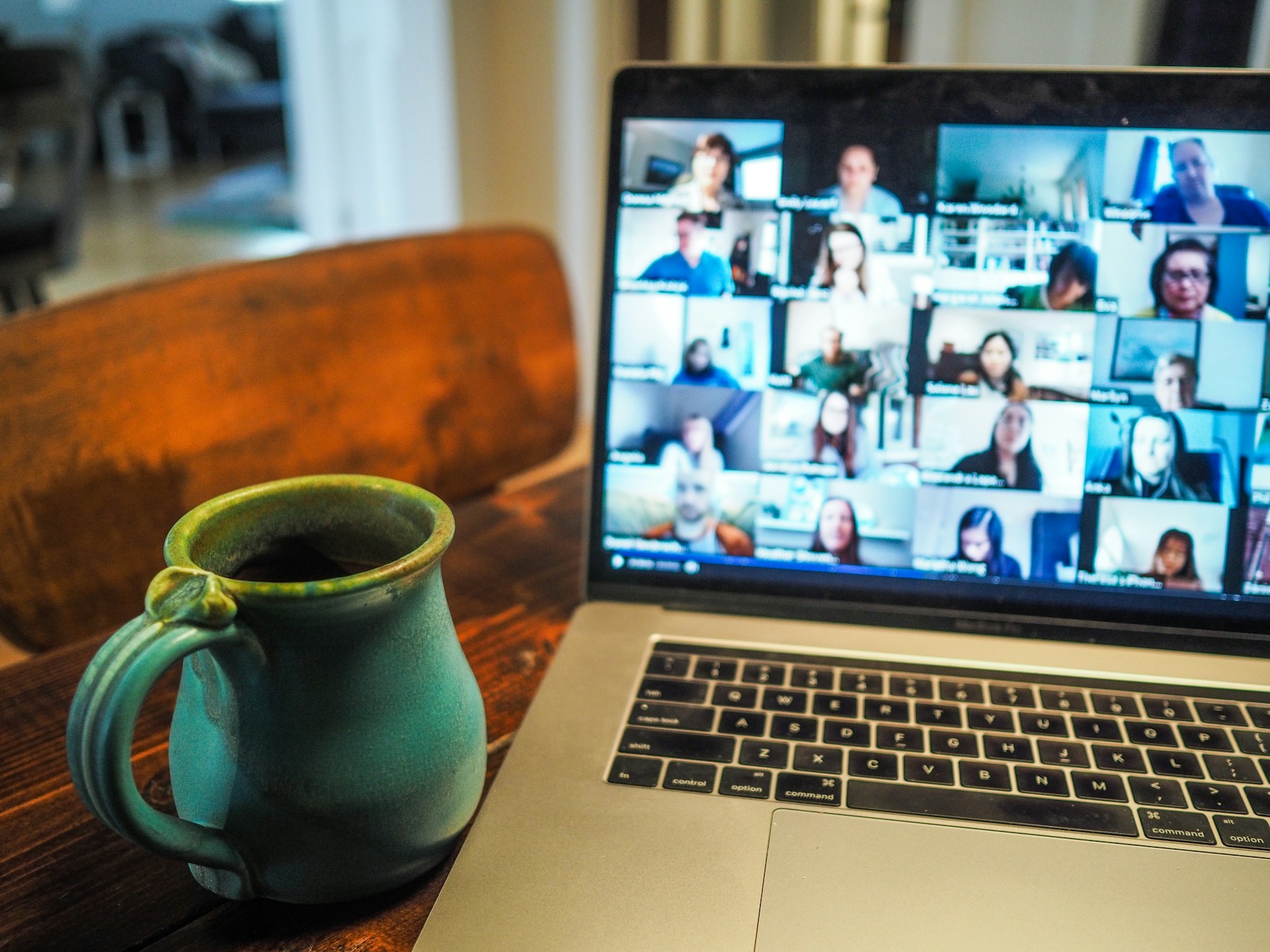A cup in front of a laptop