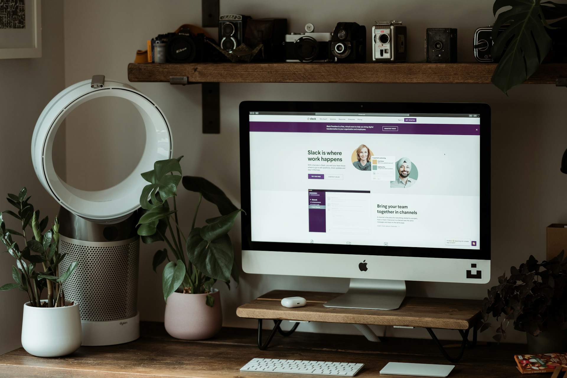 A monitor with a display of the slack website