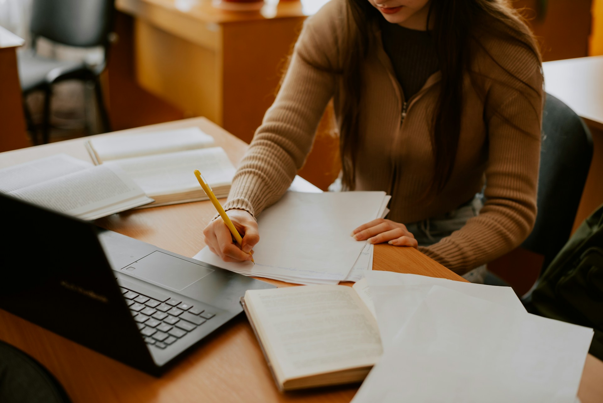 Woman sitting with papers on a table