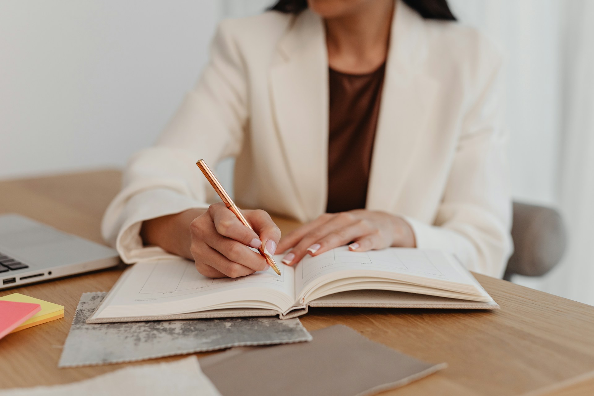 Women holding a pen and a notebook