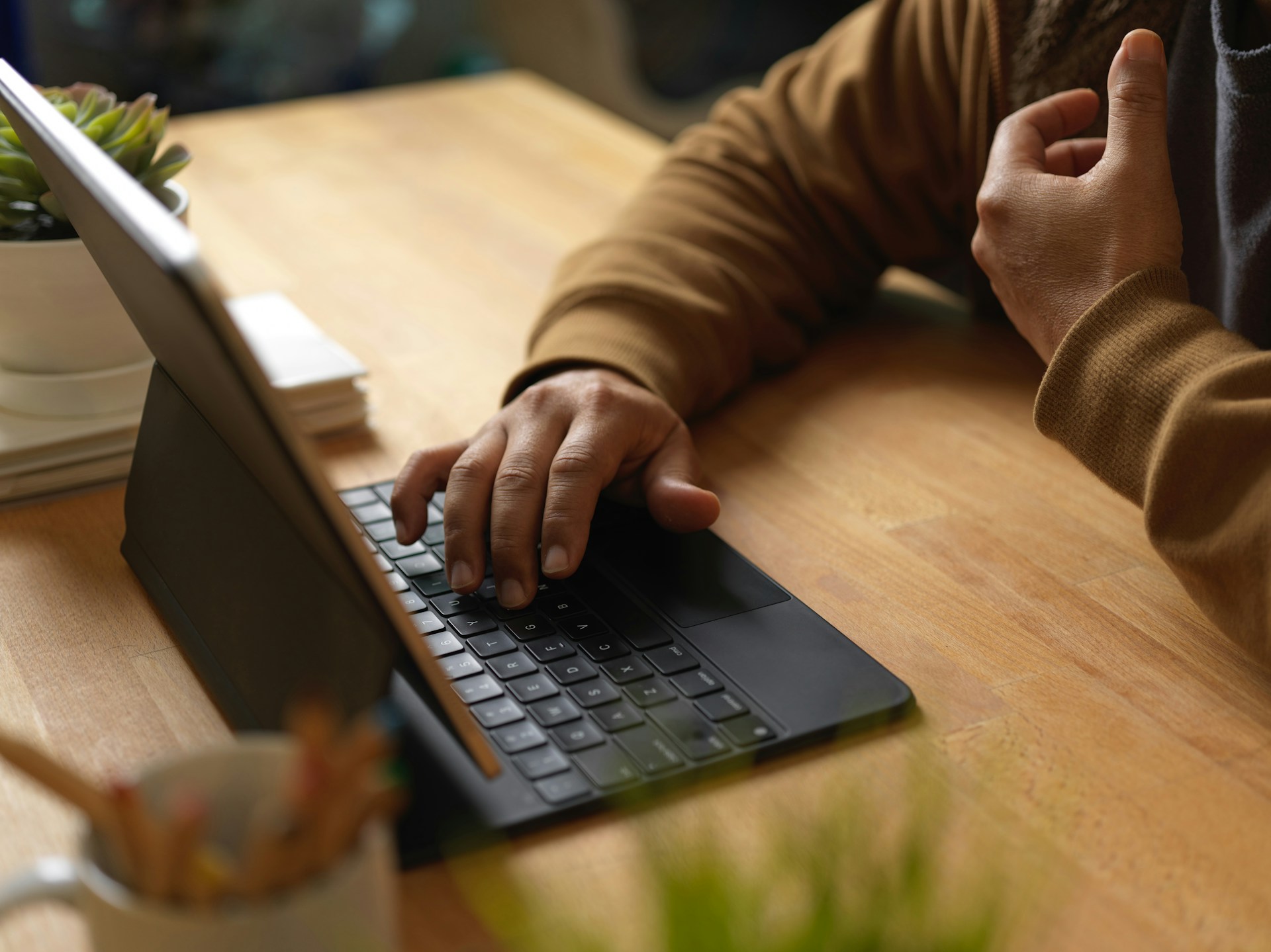 A person typing on a laptop