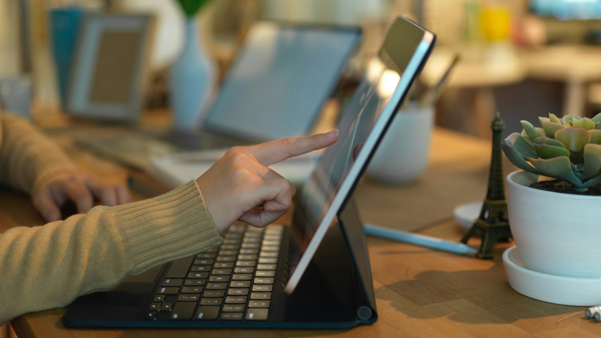 A person pointing a finger on a laptop