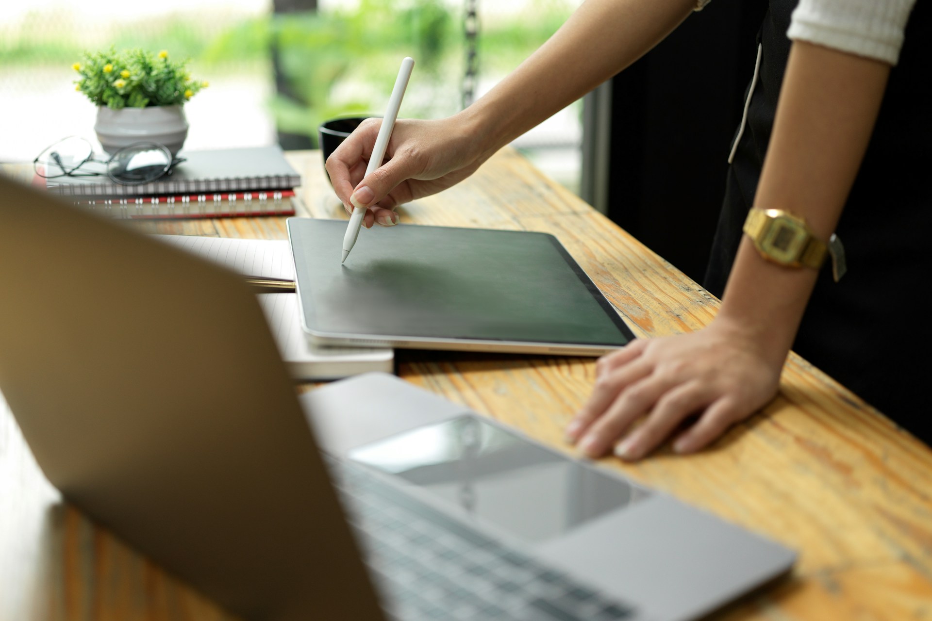 A person using a pen on a tablet