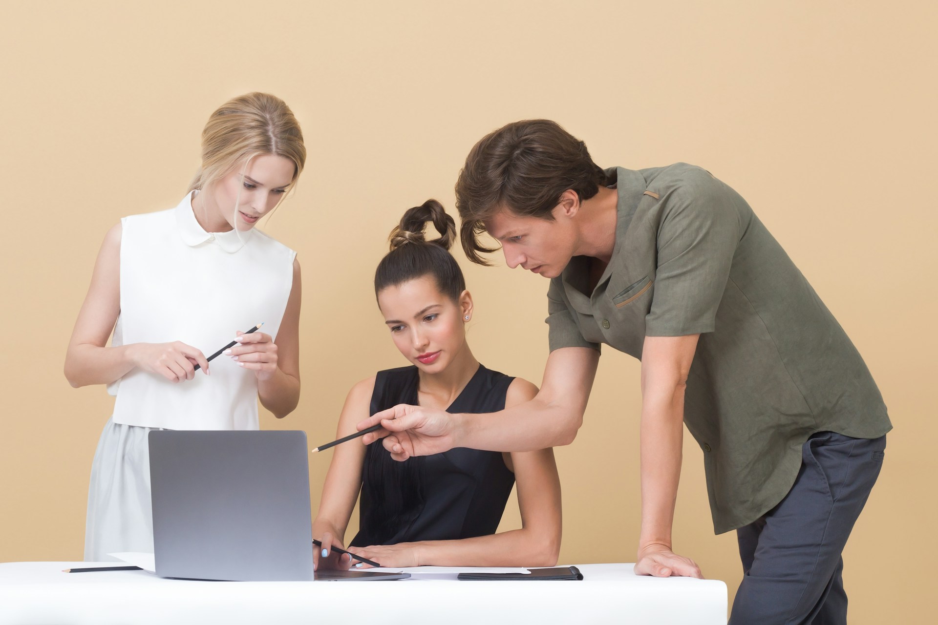 Group of people checking on a laptop